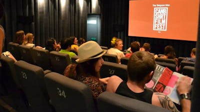 Cinema Screen showing CSFF logo with audience watching from right side