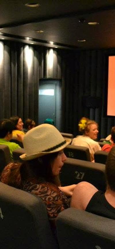 Cinema Screen showing CSFF logo with audience watching from right side