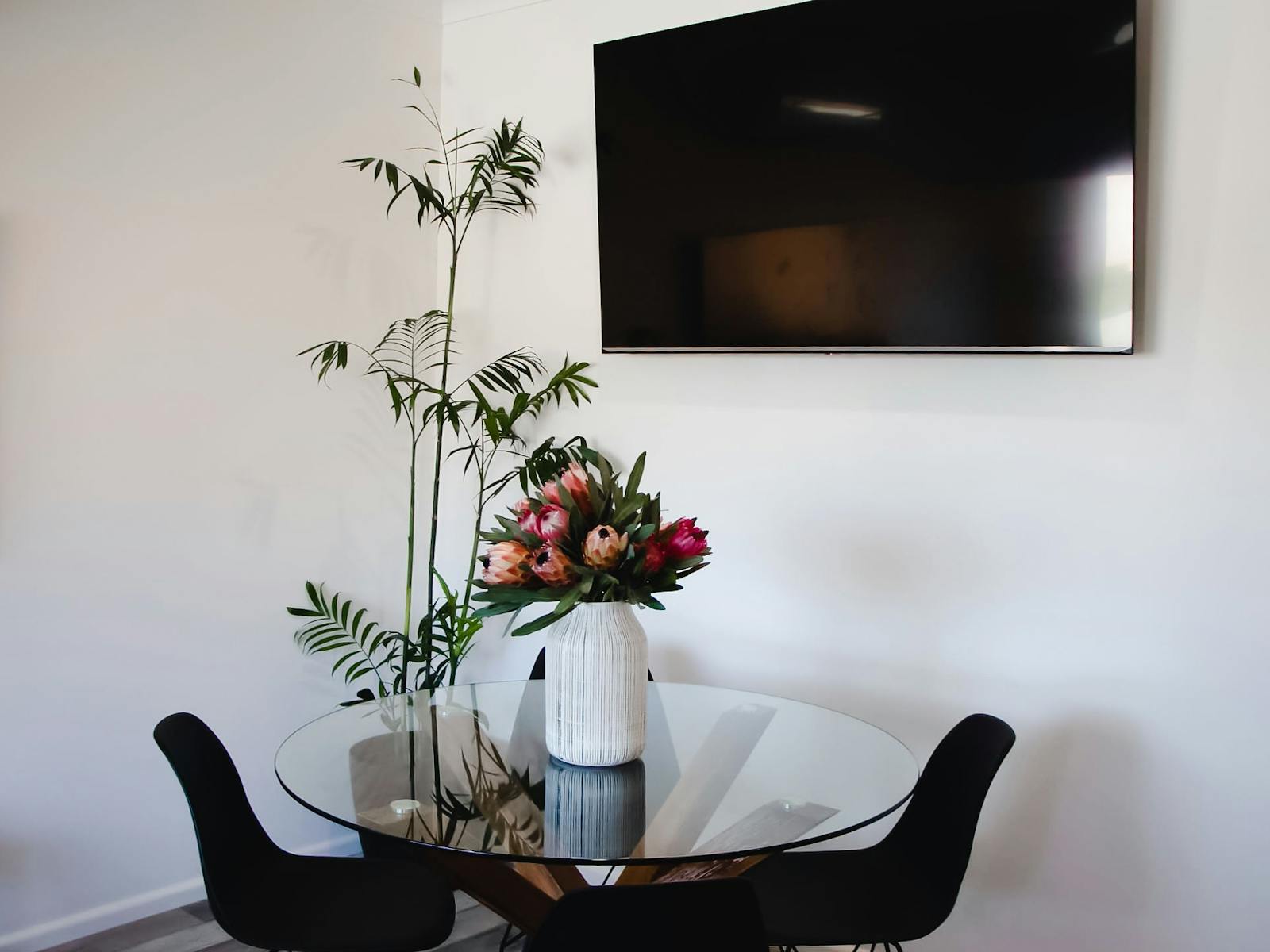 6 seater dining table with native flowers and 65" Smart TV