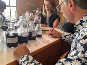 Man writing notes on wine