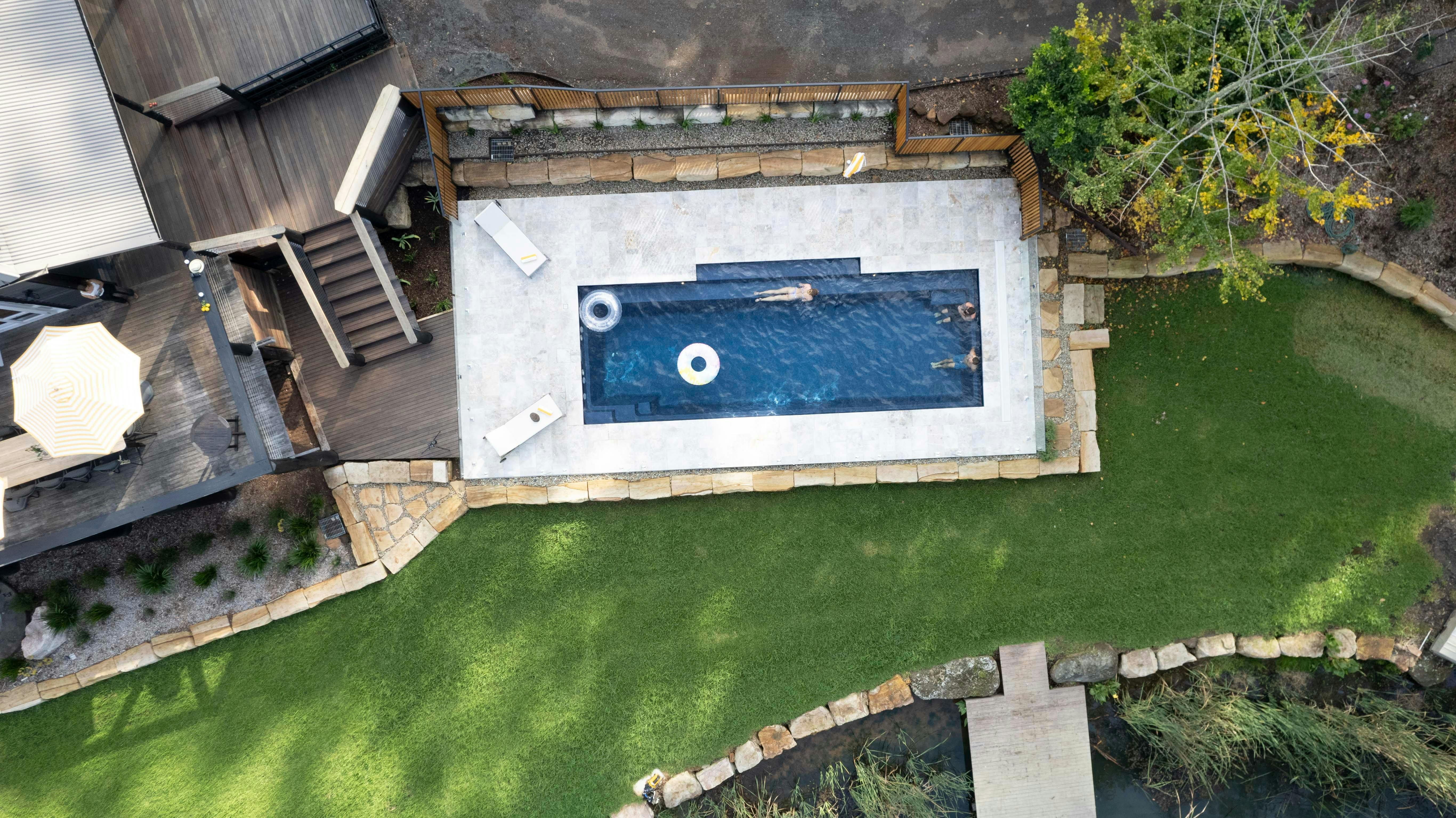 Aerial image of swimming pool with two pool rings floating