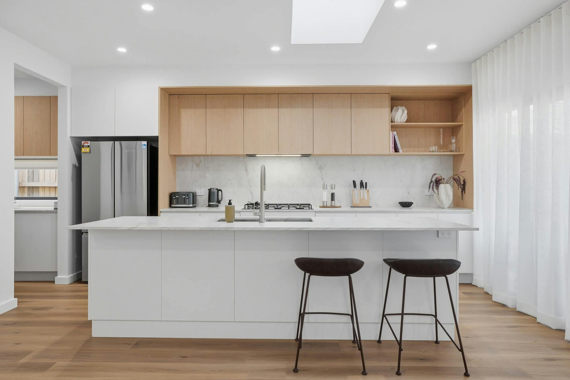 Brand new kitchen with island bench, modern cabinets and appliances