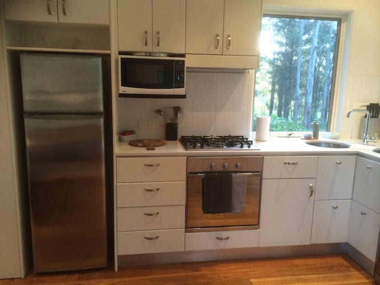 Kitchen with all facilities, oven . microwave dishwasher and fridge.. Pots, dinner ware and cutlery