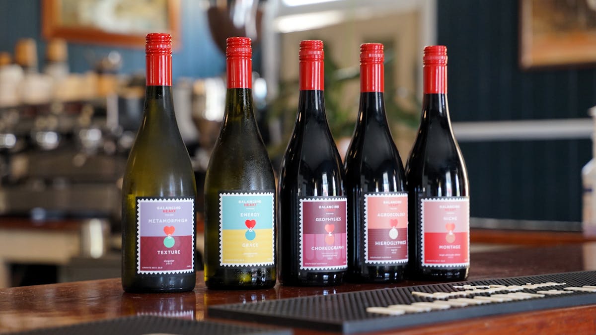 Five bottle of wine sitting on the bar
