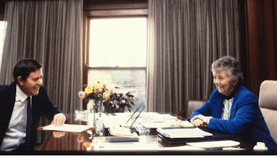 Joan Child sitting at her desk in the Speaker's Suite