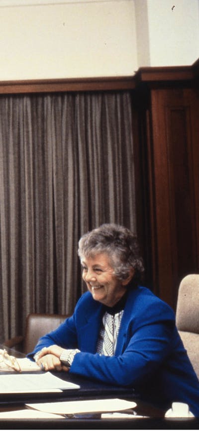 Joan Child sitting at her desk in the Speaker's Suite