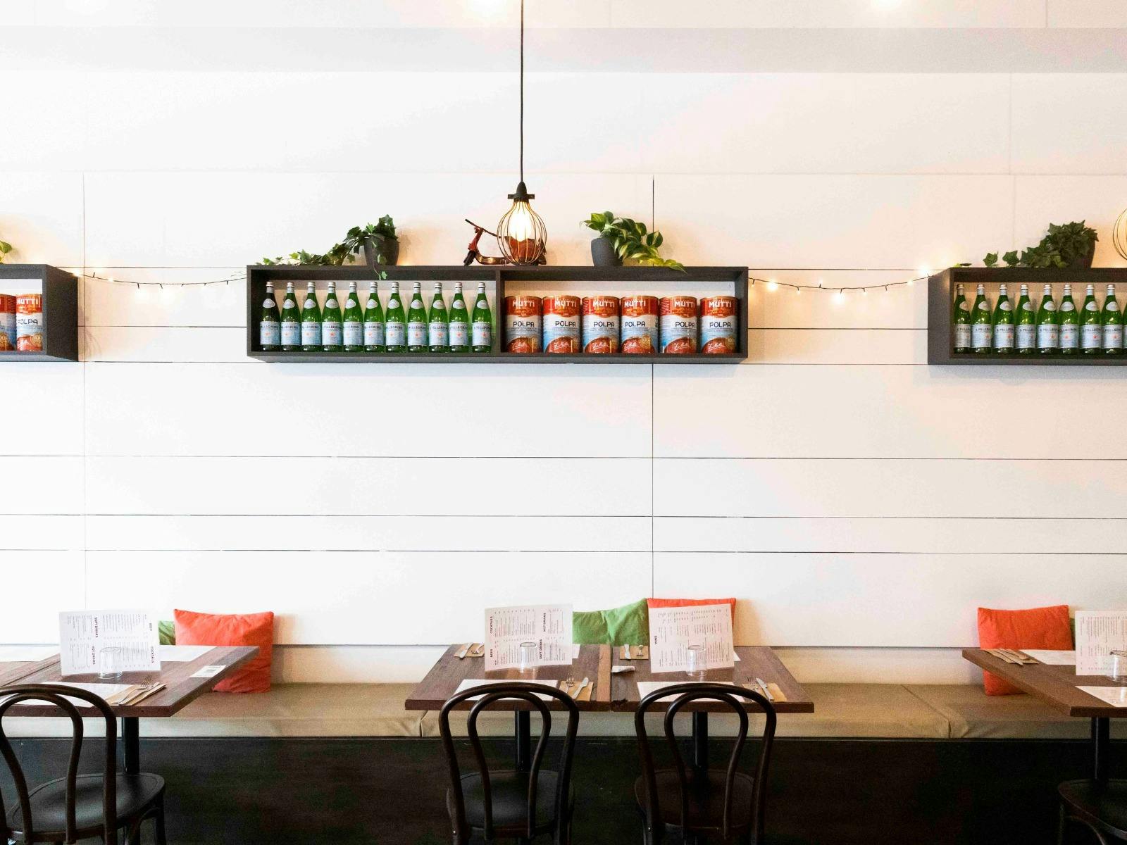 image of tables and chairs of a restaurant