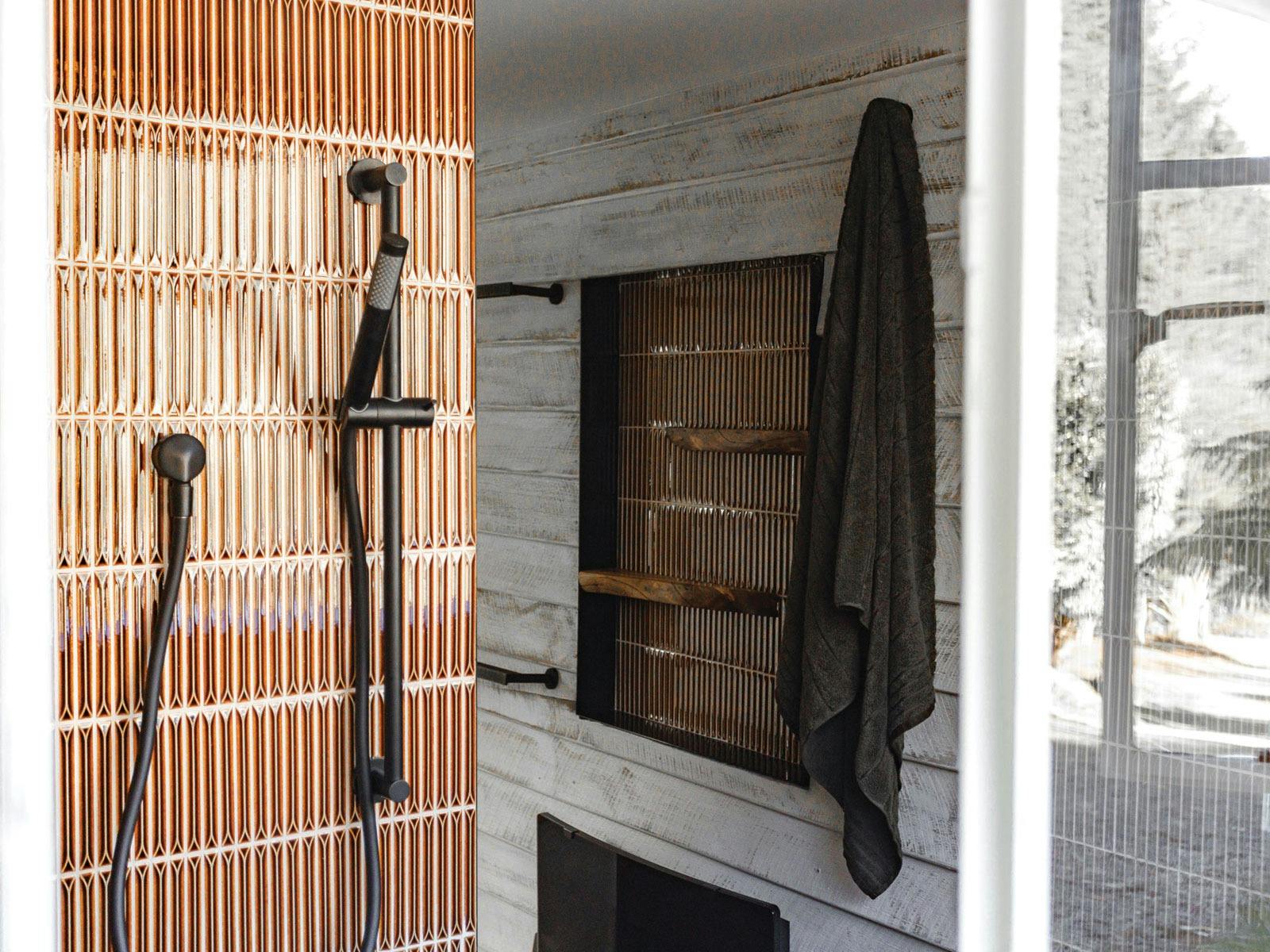 View of the bathroom and shower looking in from the external window.
