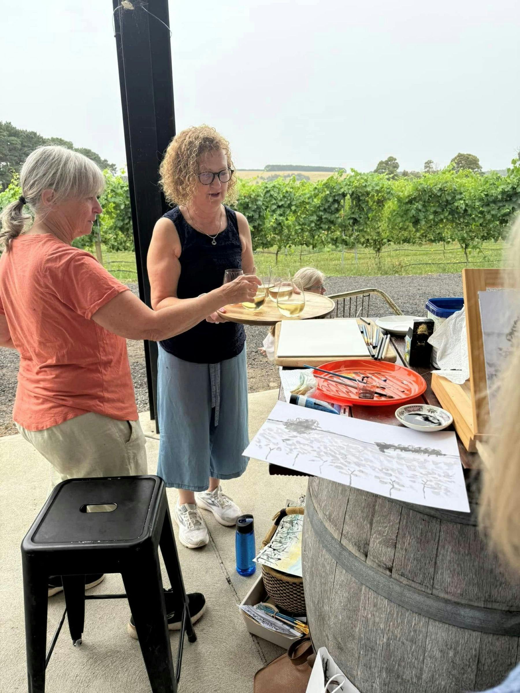 glass of Keayang wine while painting a picture