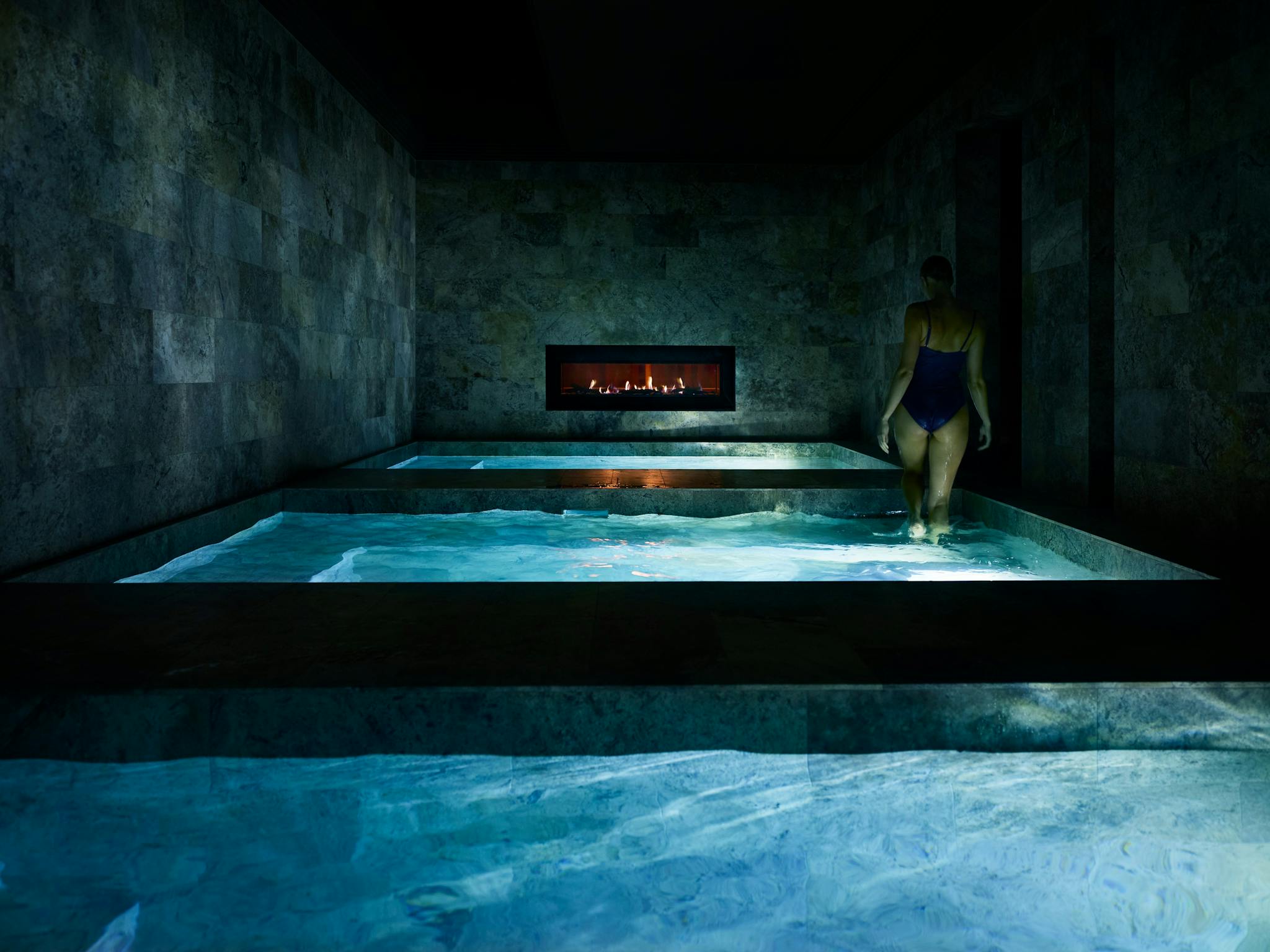 Woman steps out of pool. Woman steps out of pool.