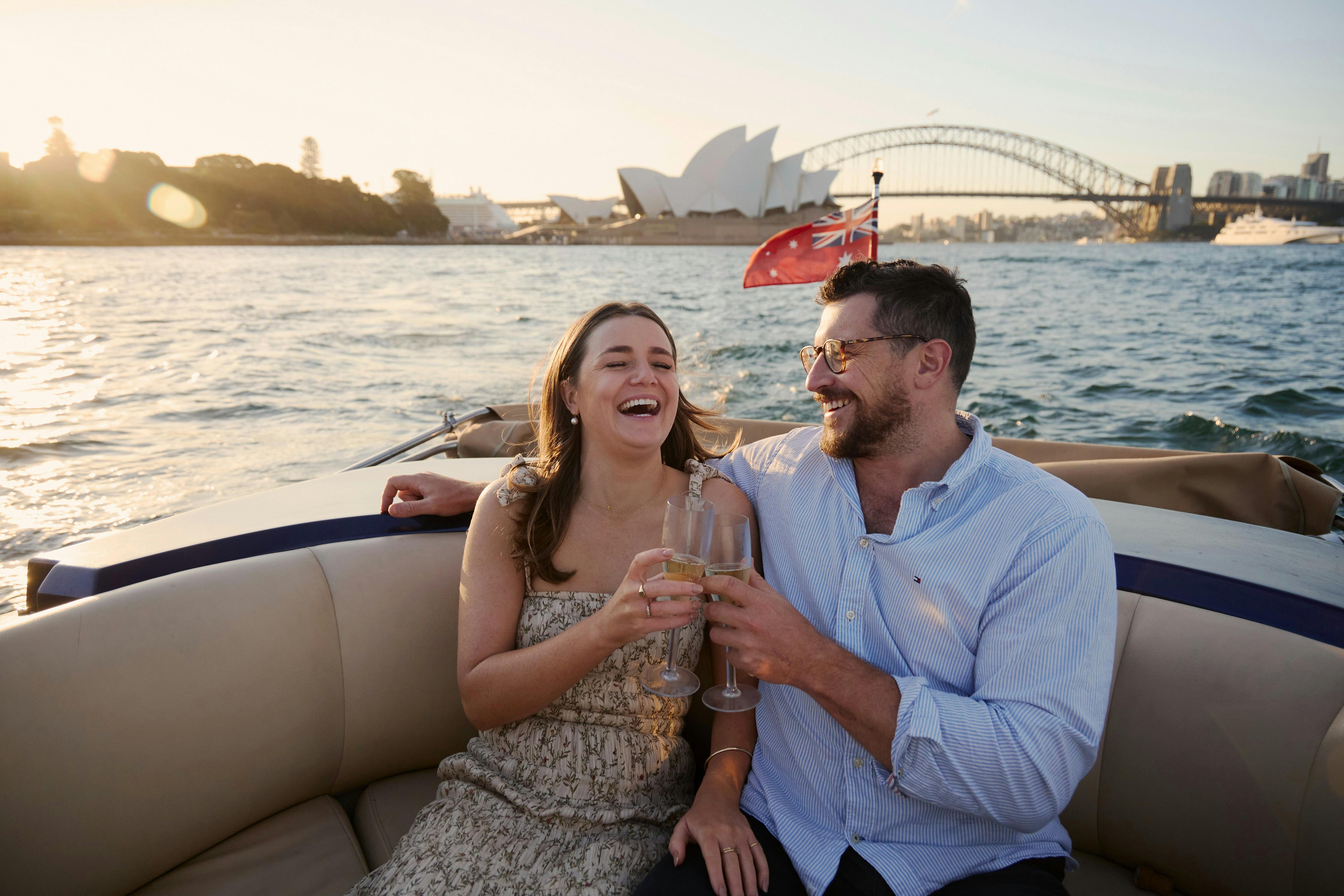 Private boat tour on MV Aquamajestic cruising Sydney Harbour with city skyline views.