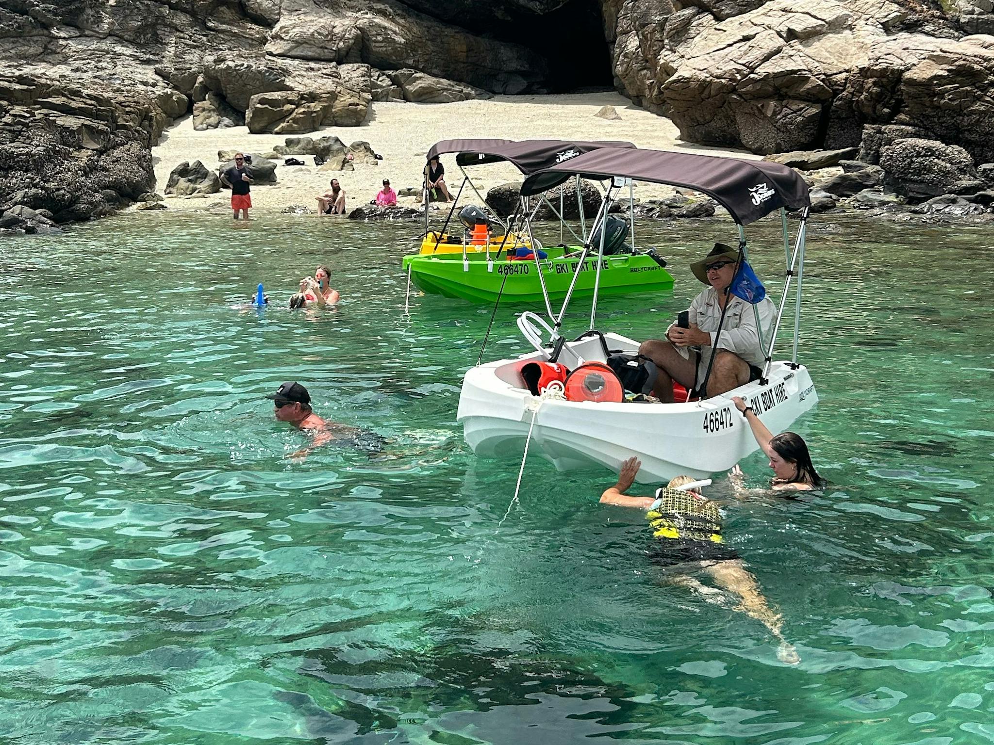 Snorkelling beside hire boats in clear water at Great Keppel Island, QLD. Snorkelling beside hire boats in clear water at Great Keppel Island, QLD.