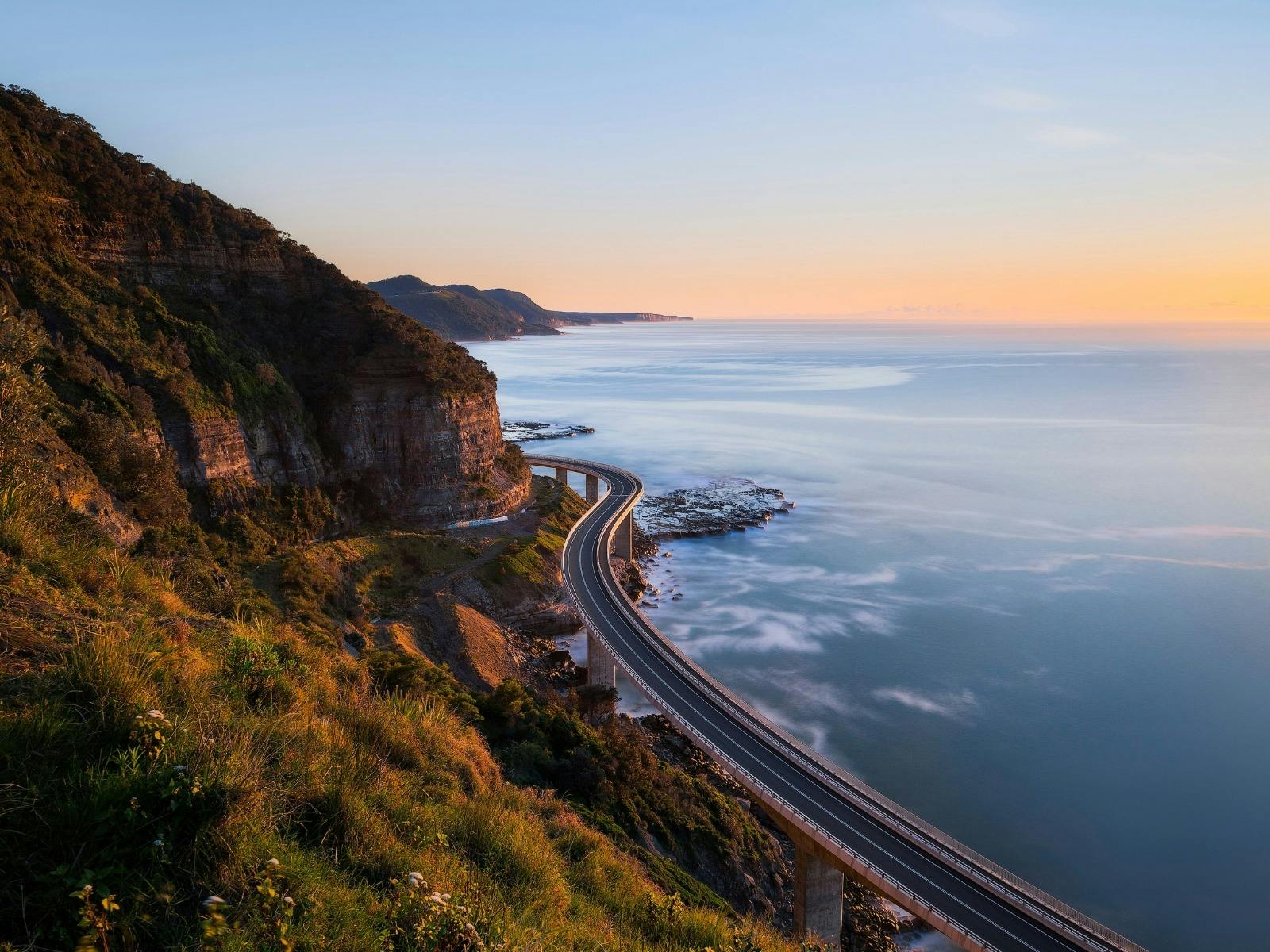 Aerial view of the ocean with mountain landscapes in the distance