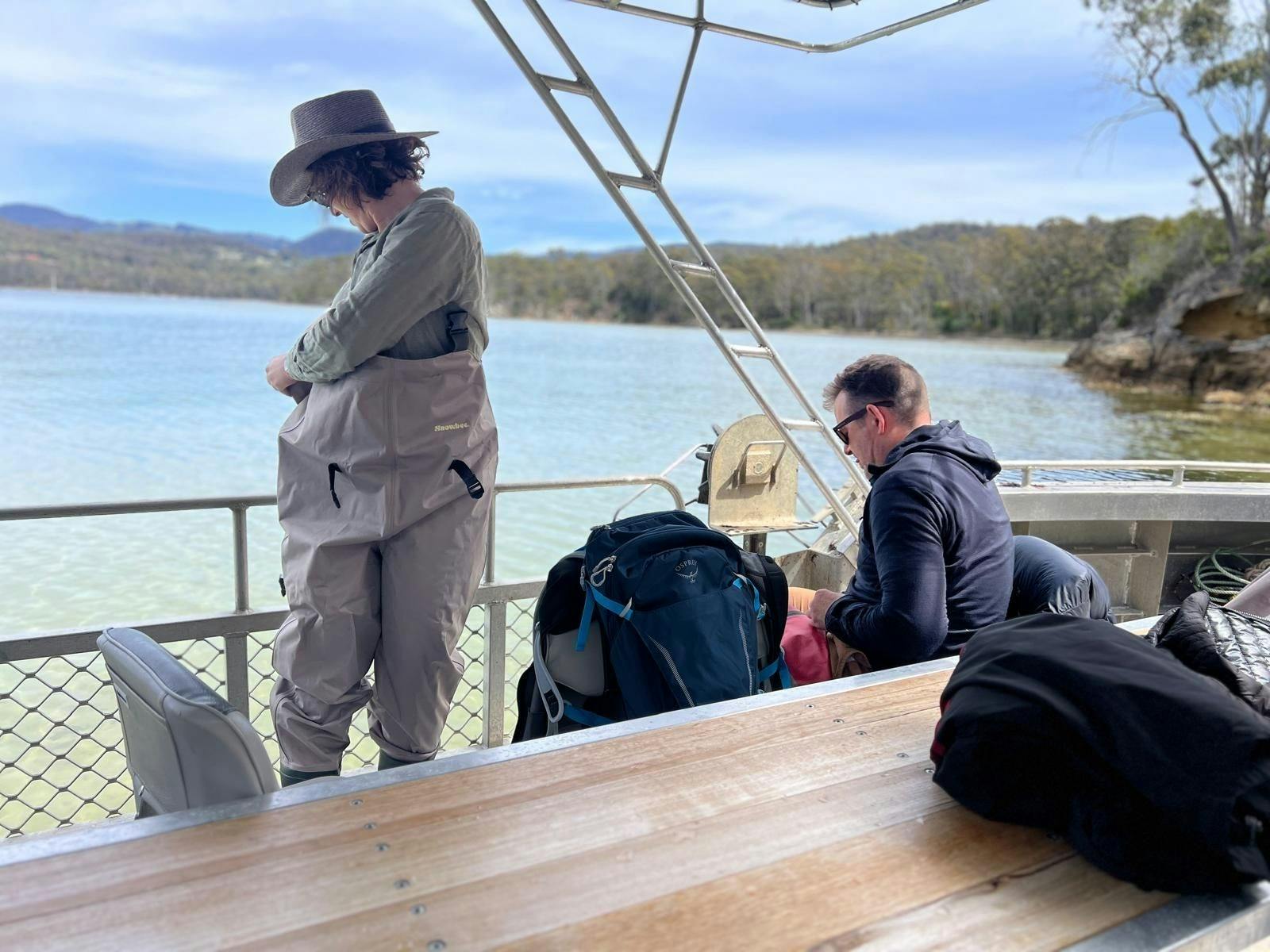 Guest putting on and adjusting waders