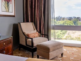 Suede chair and footstool, Executive Suite, Botanic Gardens view, Royal on the Park Hotel Brisbane