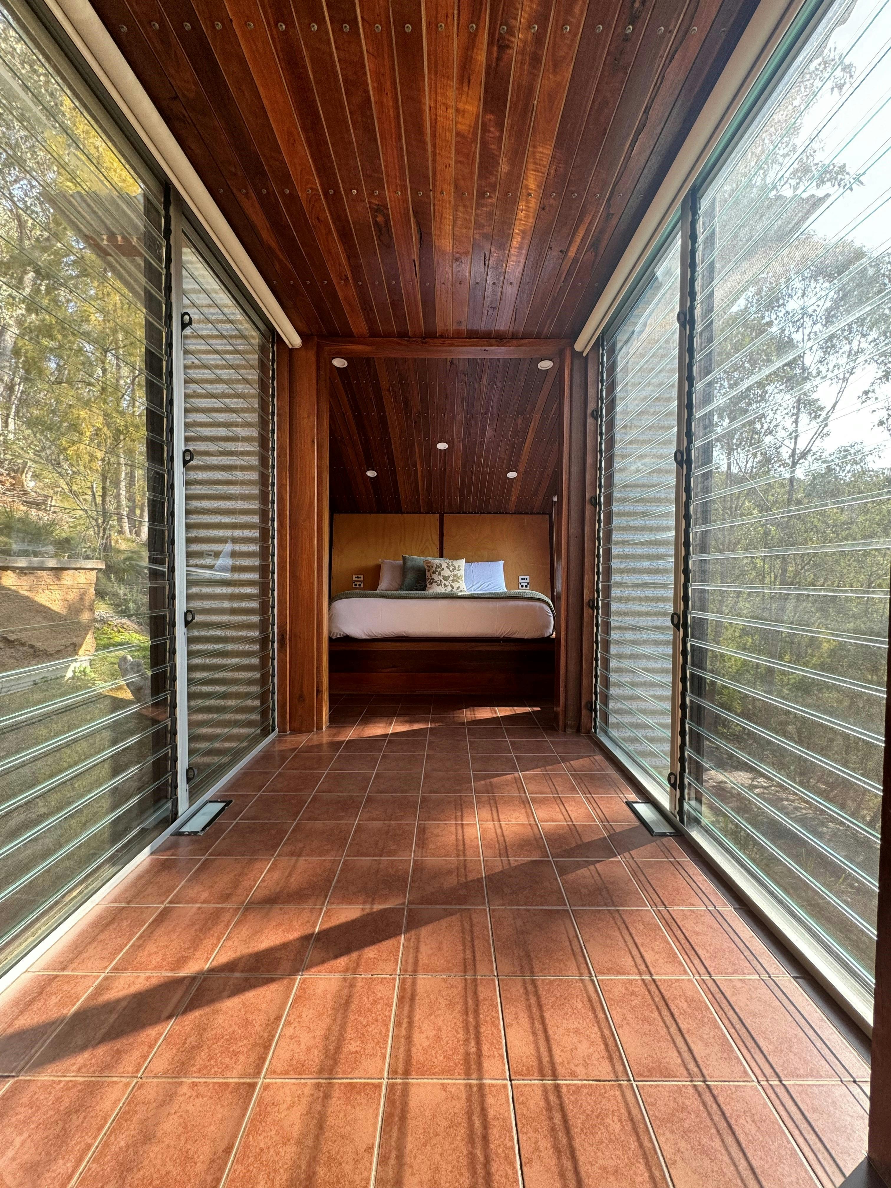 Bedroom and breezeway with bush surroundings