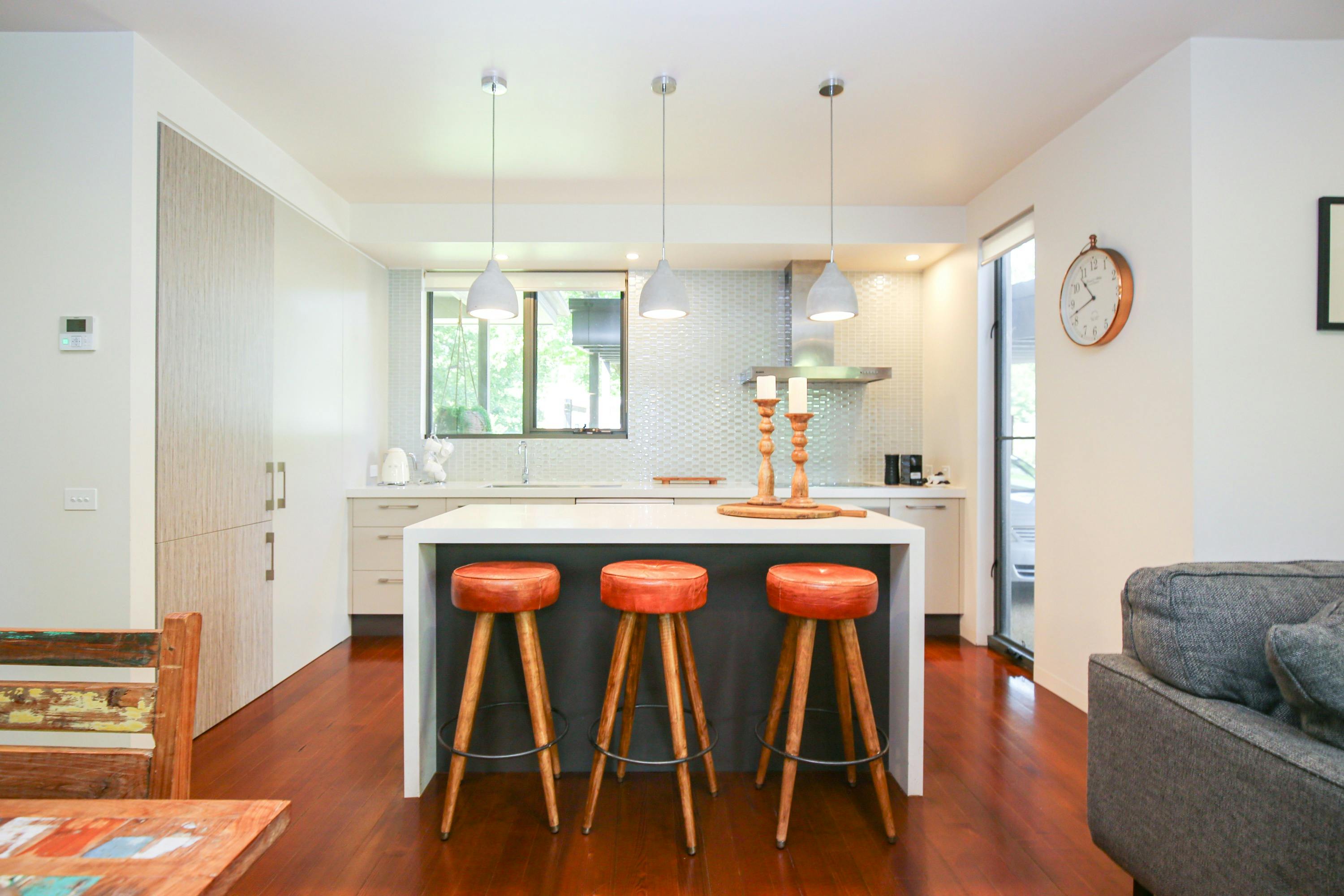 Kitchen with table and three stools