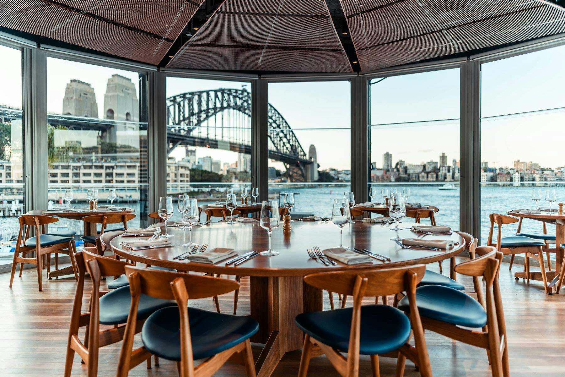 Table in a restaurant with views of the Sydney Harbour Bridge