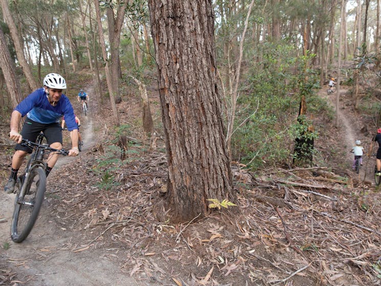 Family enjoying a day of riding on the 20km Bundadung Trail Network in Tathra