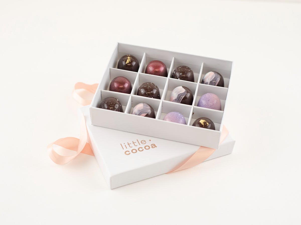 Open box of chocolates with ribbon Open box of chocolates with ribbon