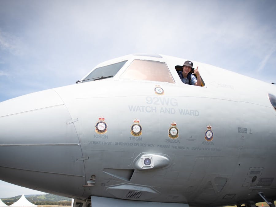 Child sitting in the cockpit of a Royal Australian Air Force plane