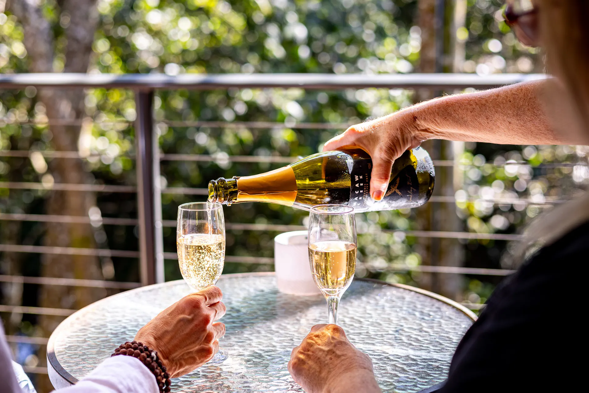 Sitting on the deck with a glass of bubbles