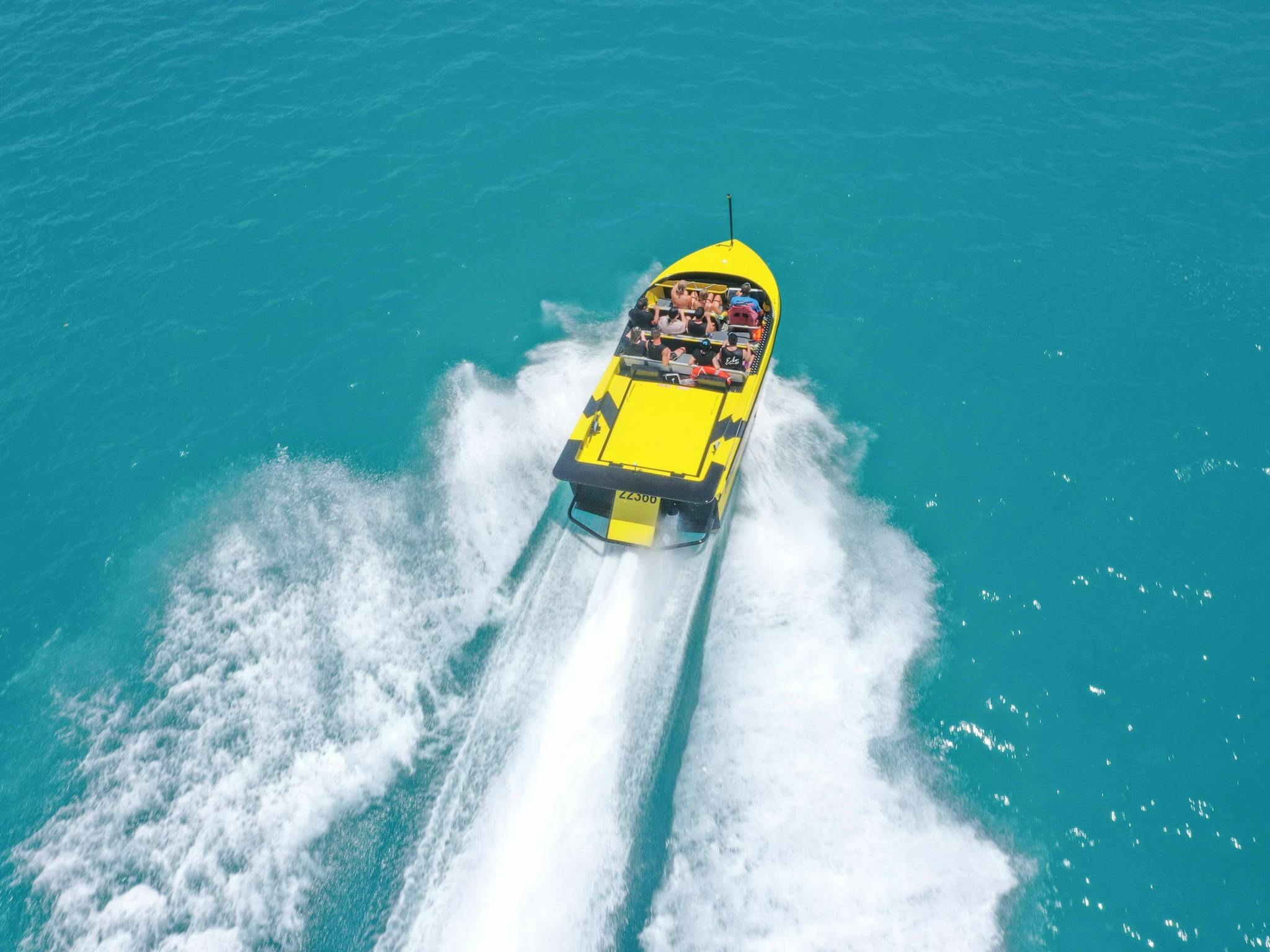 aerial image of jet boat moving at speed aerial image of jet boat moving at speed