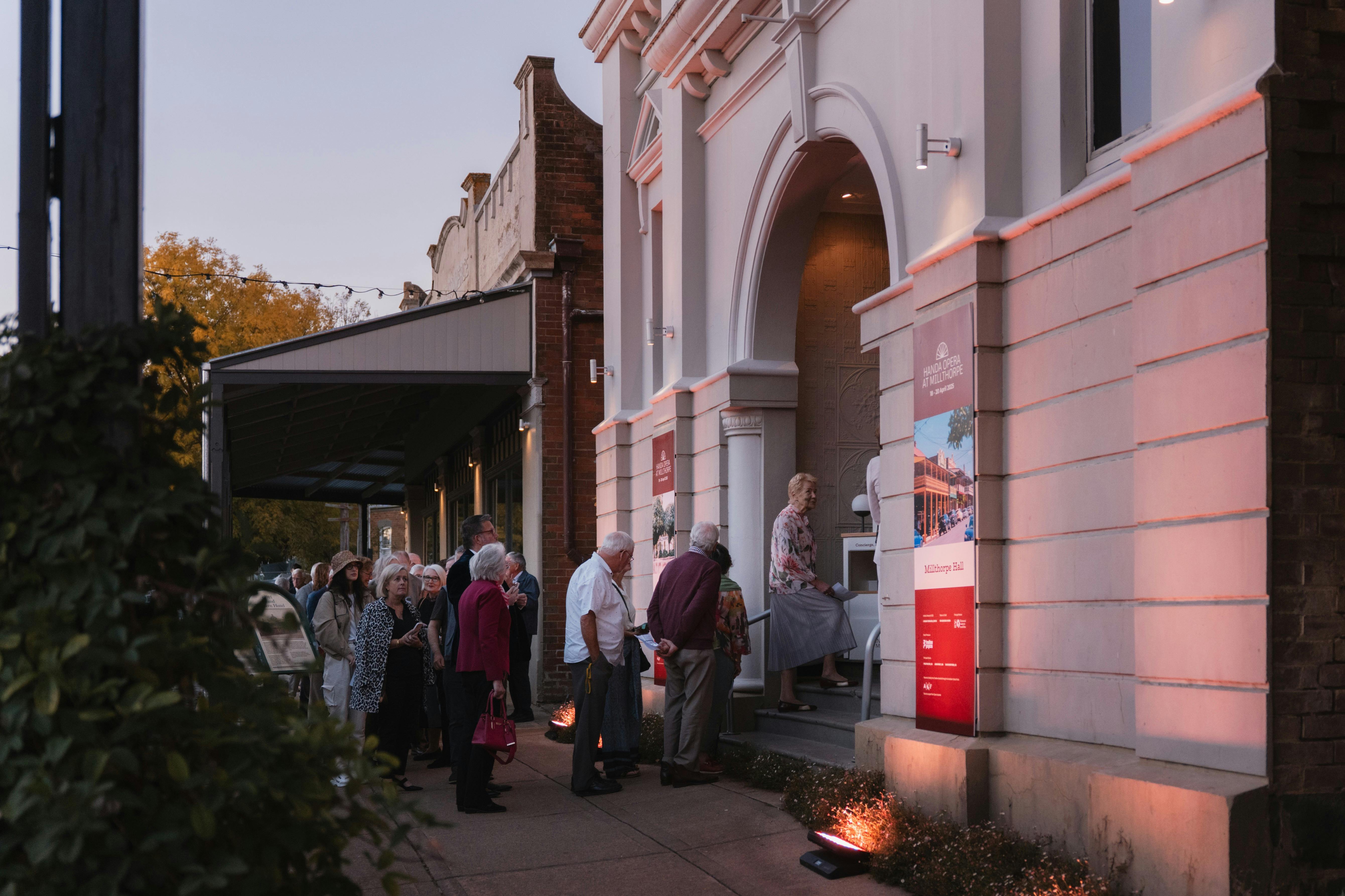 Audience members filing into the Millthorpe Hall