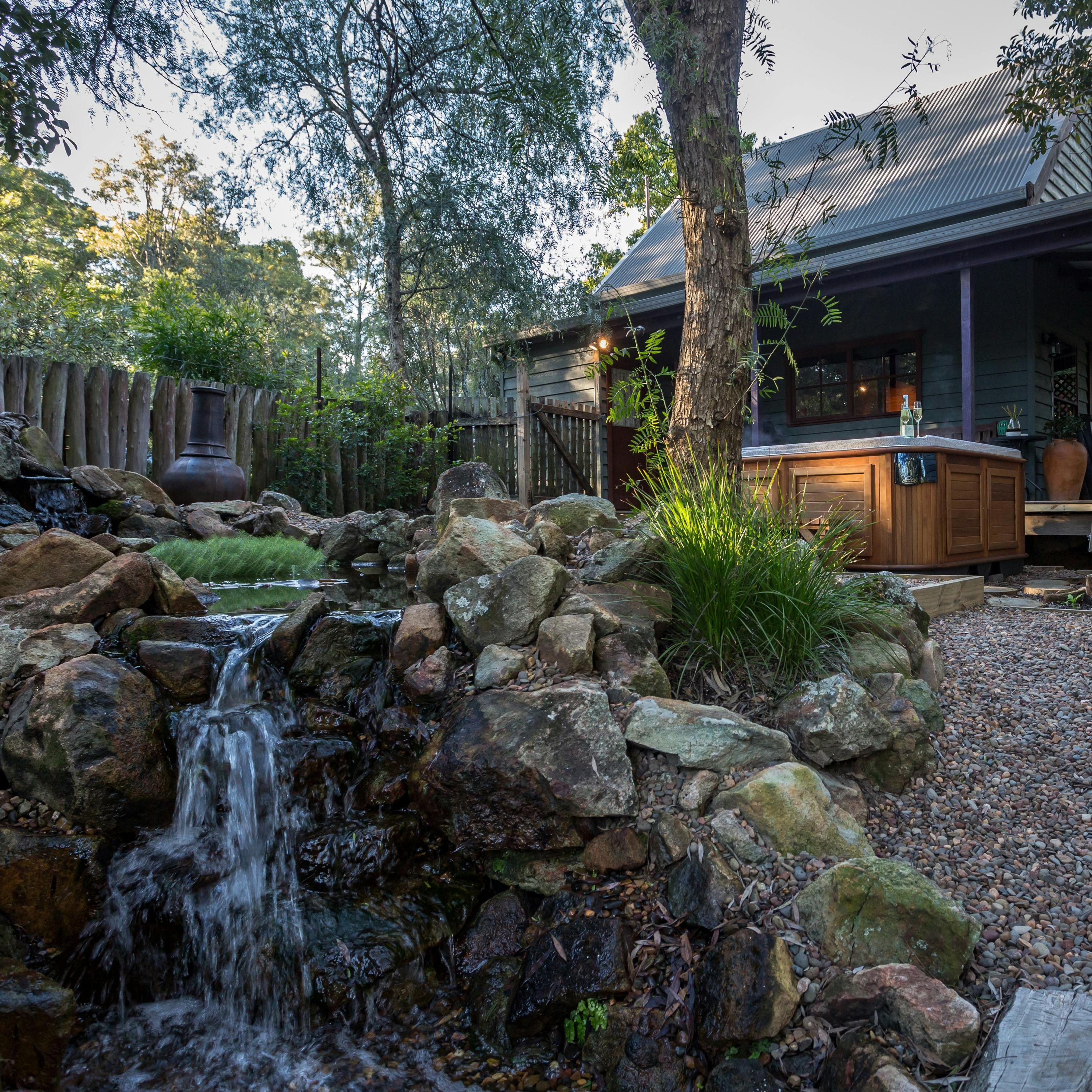 View of Tallarook Cabins spa and pond setting