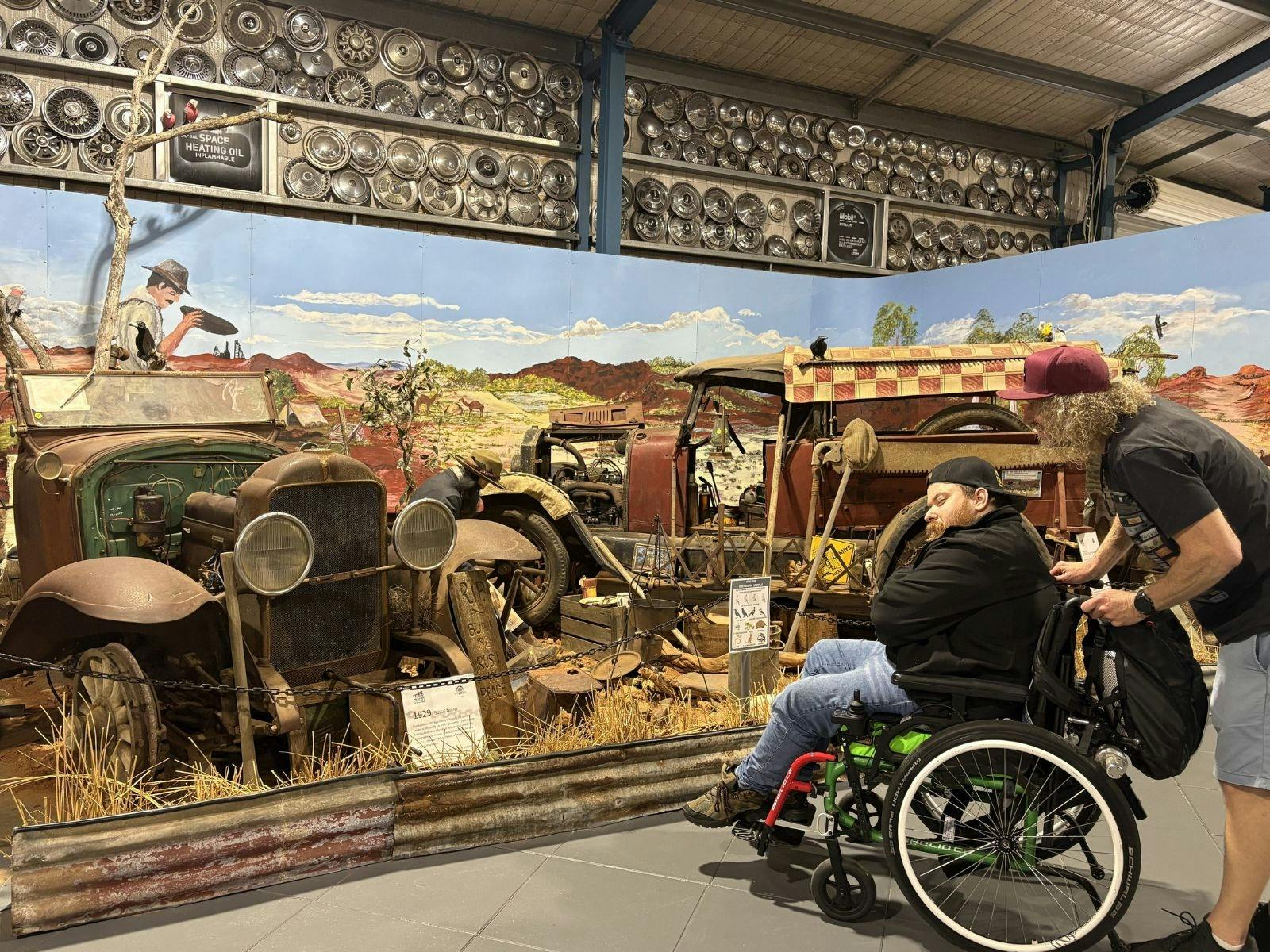 Two men looking at the Gold Rush display