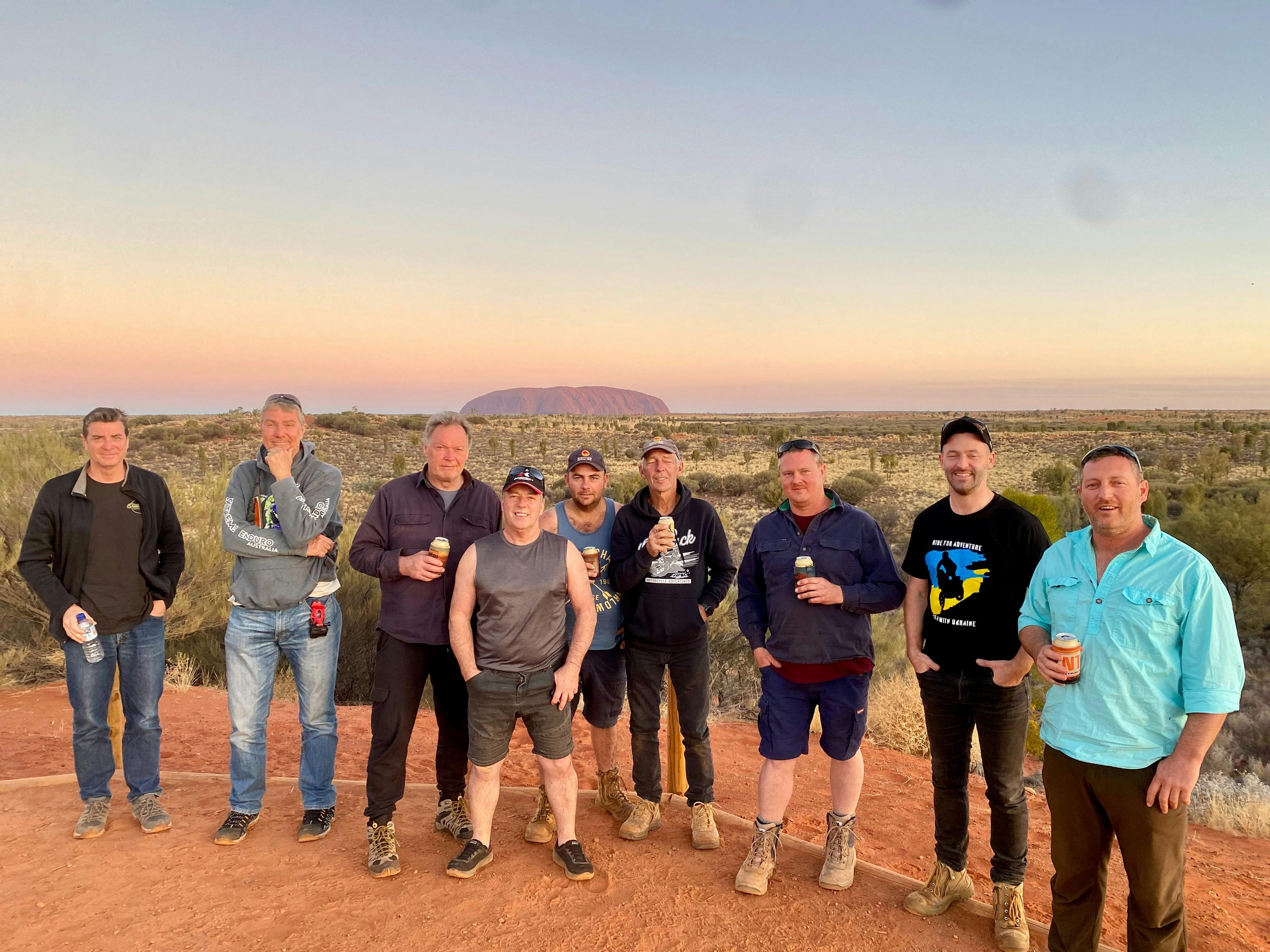 Customers enjoying sunset over Uluru