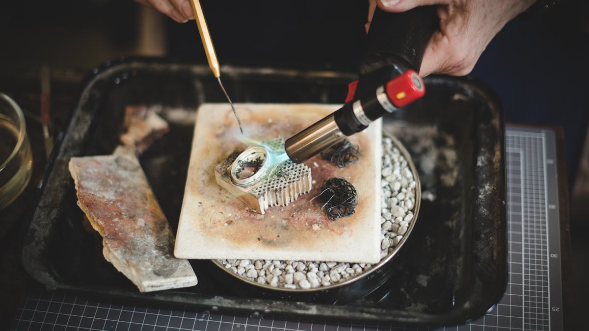 Silversmith pieces together pendant