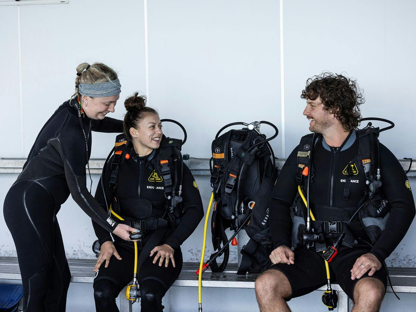 A couple getting ready for a scuba dive