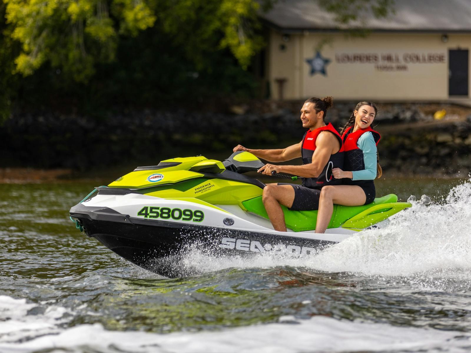 A couple enjoying a jetski ride smiling and laughing. A couple enjoying a jetski ride smiling and laughing.