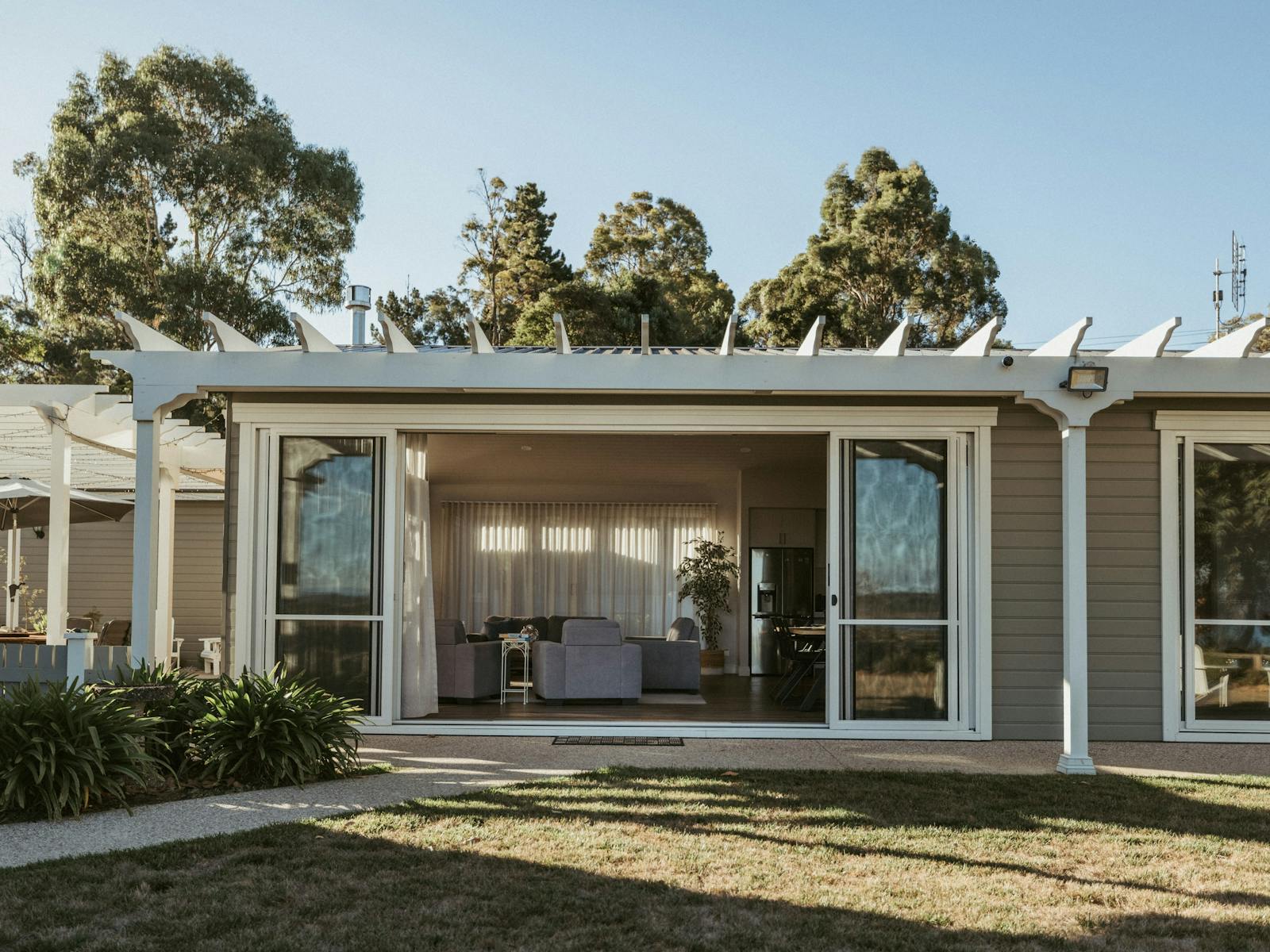 Light-filled open-plan living with sliding doors for seamless indoor-outdoor flow.
