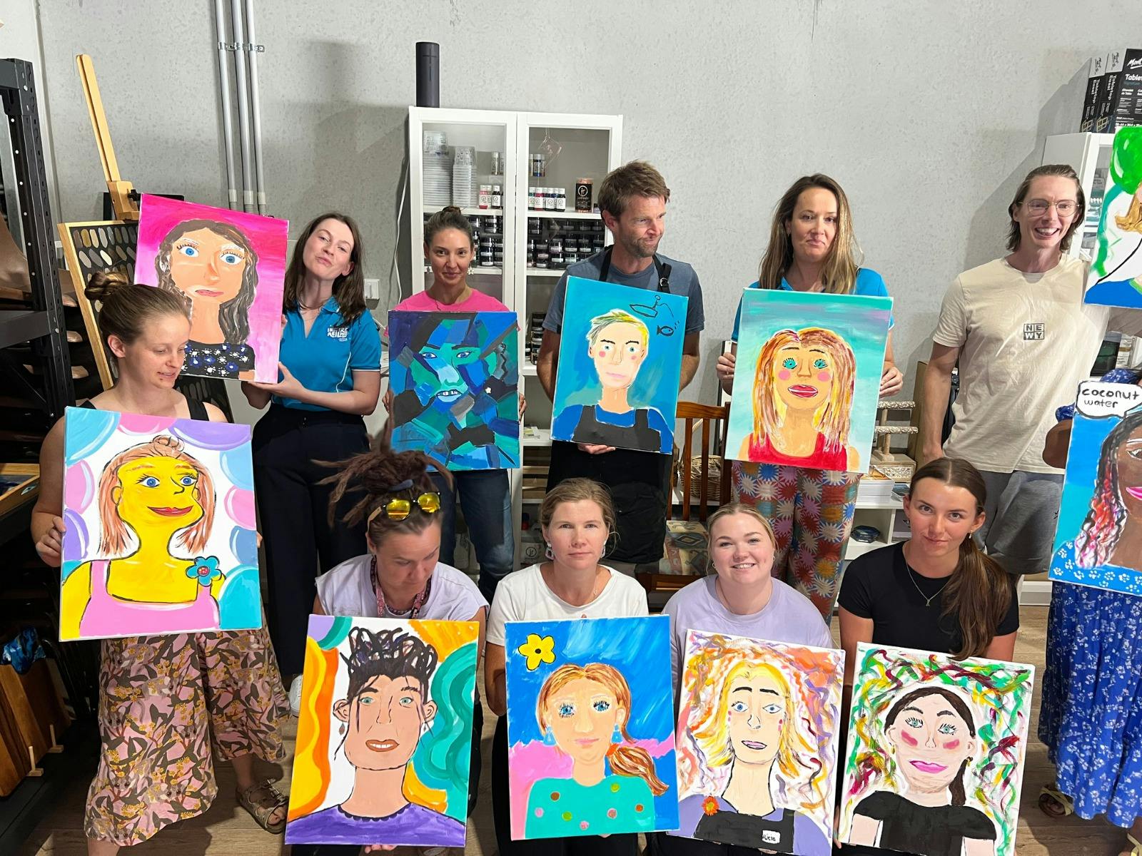 Group of people holding self portraits