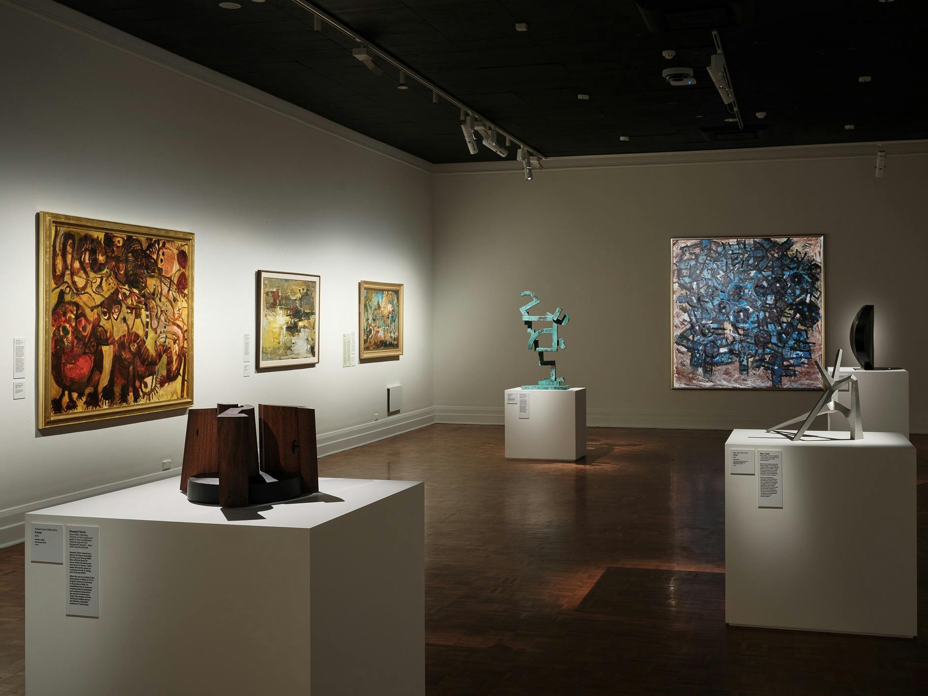 View of Becoming Modern exhibition with artwork and sculpture