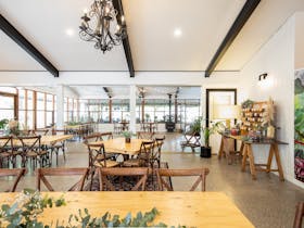 Taken from the back room- looking towards the grassed area, featuring our indoor tables & chairs