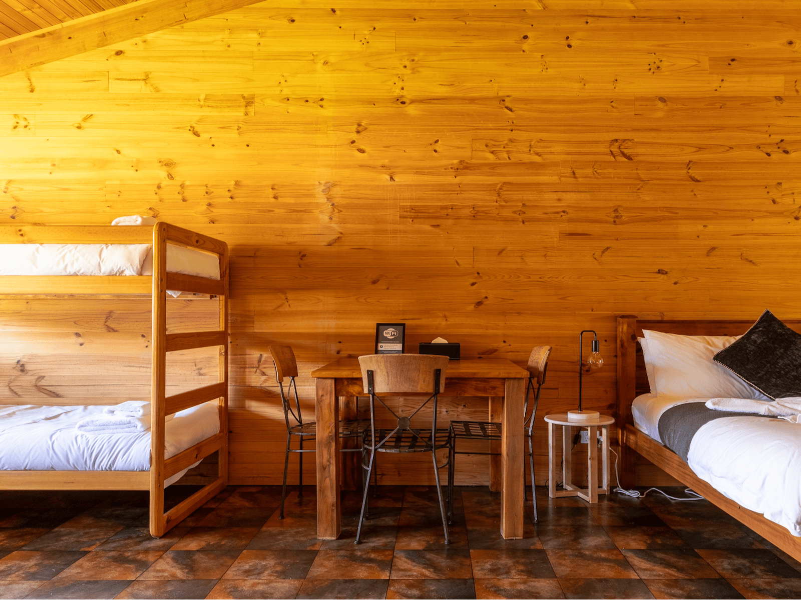 Queen bed, bulks and dinner table.