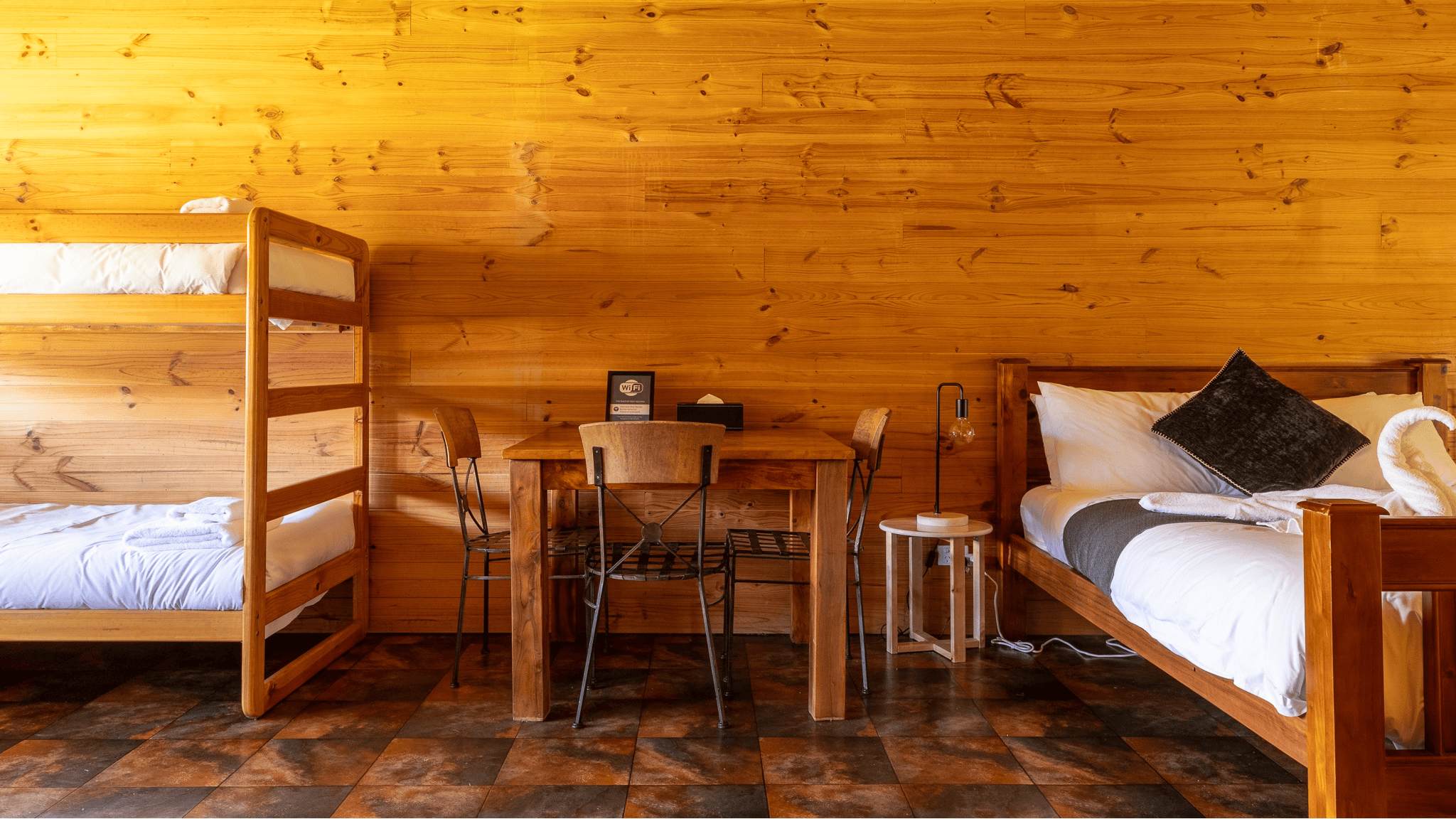 Queen bed, bulks and dinner table.