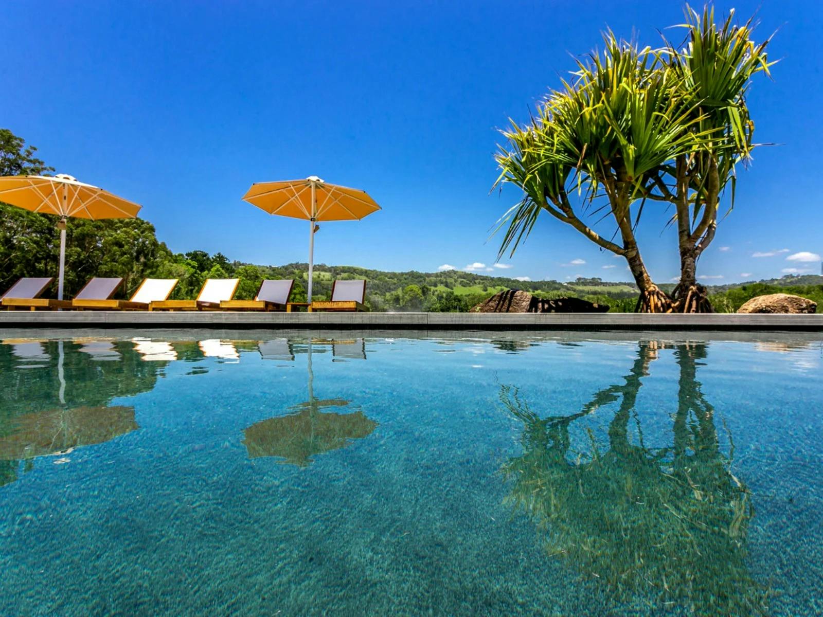 Private, expansive pool and spa with sunbeds and scenic views