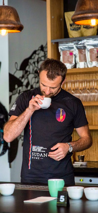 Two coffee experts smelling the coffee beans