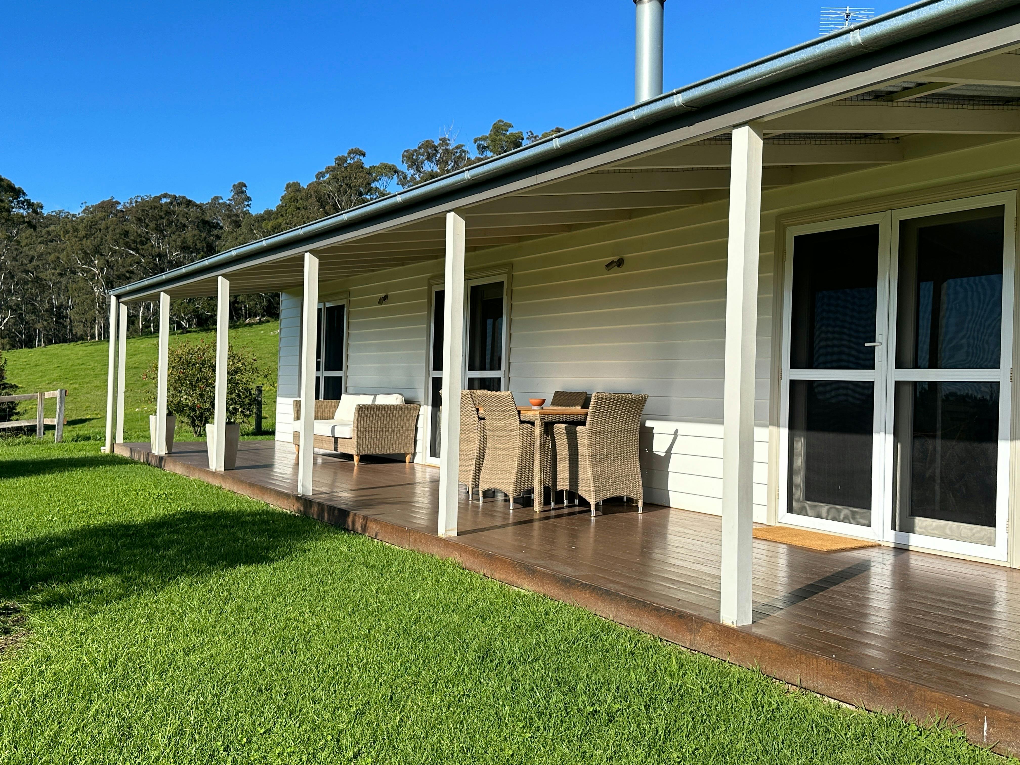 Living area and two bedrooms open through French doors to verandah, outdoor living , garden, views