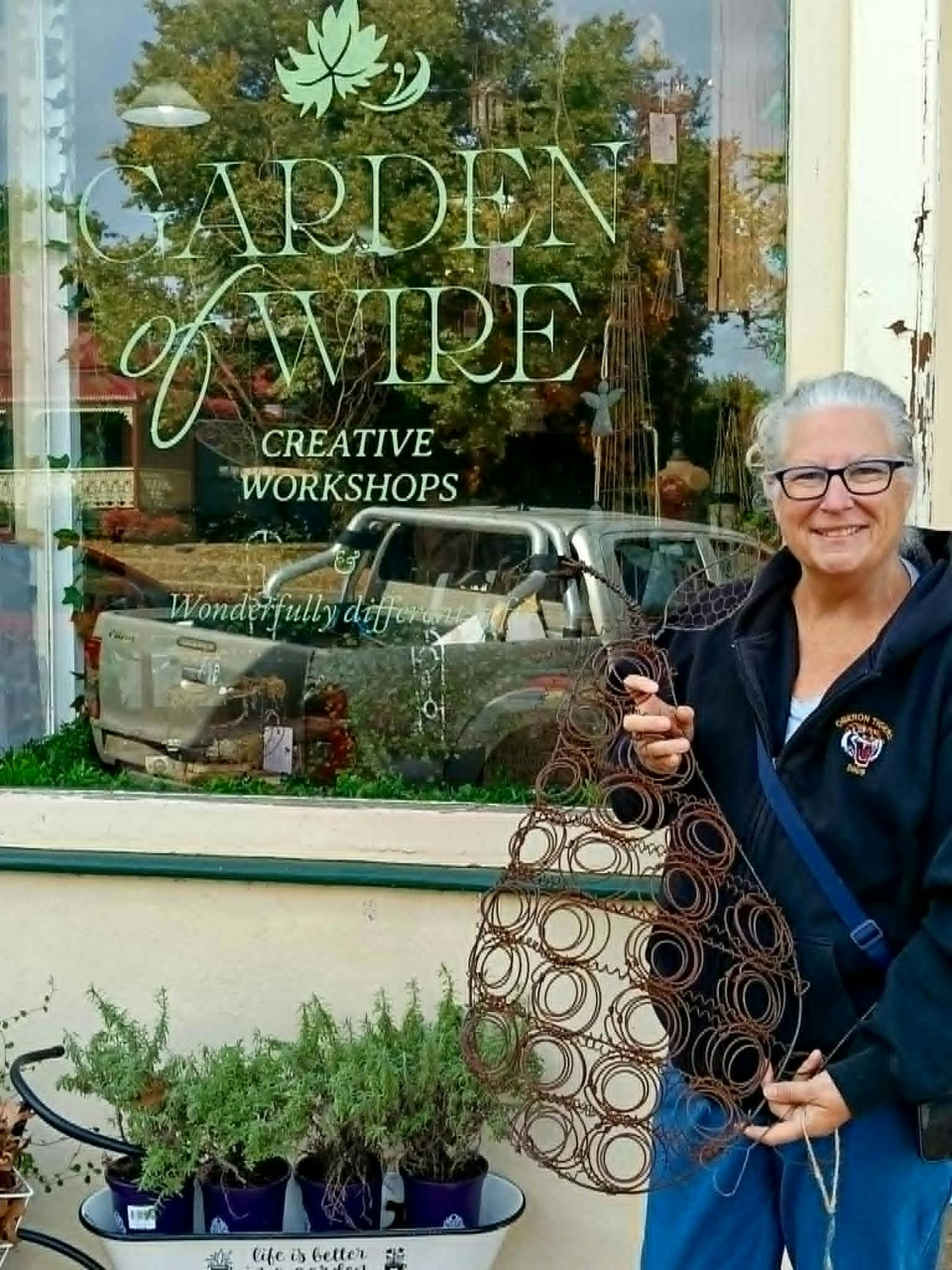 Client standing in front of shop with Embellished Pear
