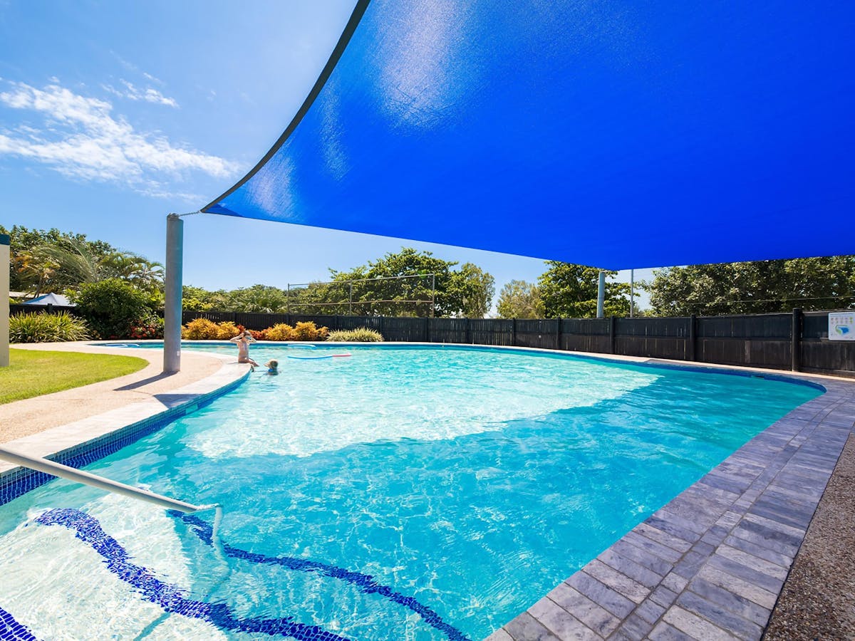 Pool view. The pool is surrounded by gardens and camping areas.