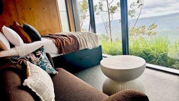 Tiny Wild House bedroom and lounge with views of the Ship Sterns Range from Binna Burra Tiny Wild House bedroom and lounge with views of the Ship Sterns Range from Binna Burra