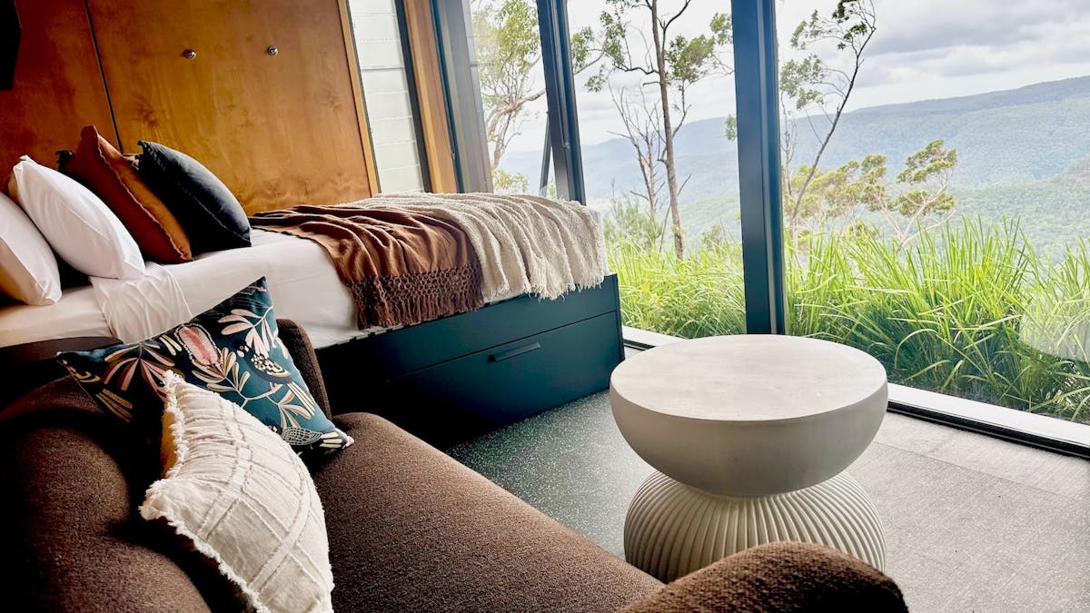 Tiny Wild House bedroom and lounge with views of the Ship Sterns Range from Binna Burra