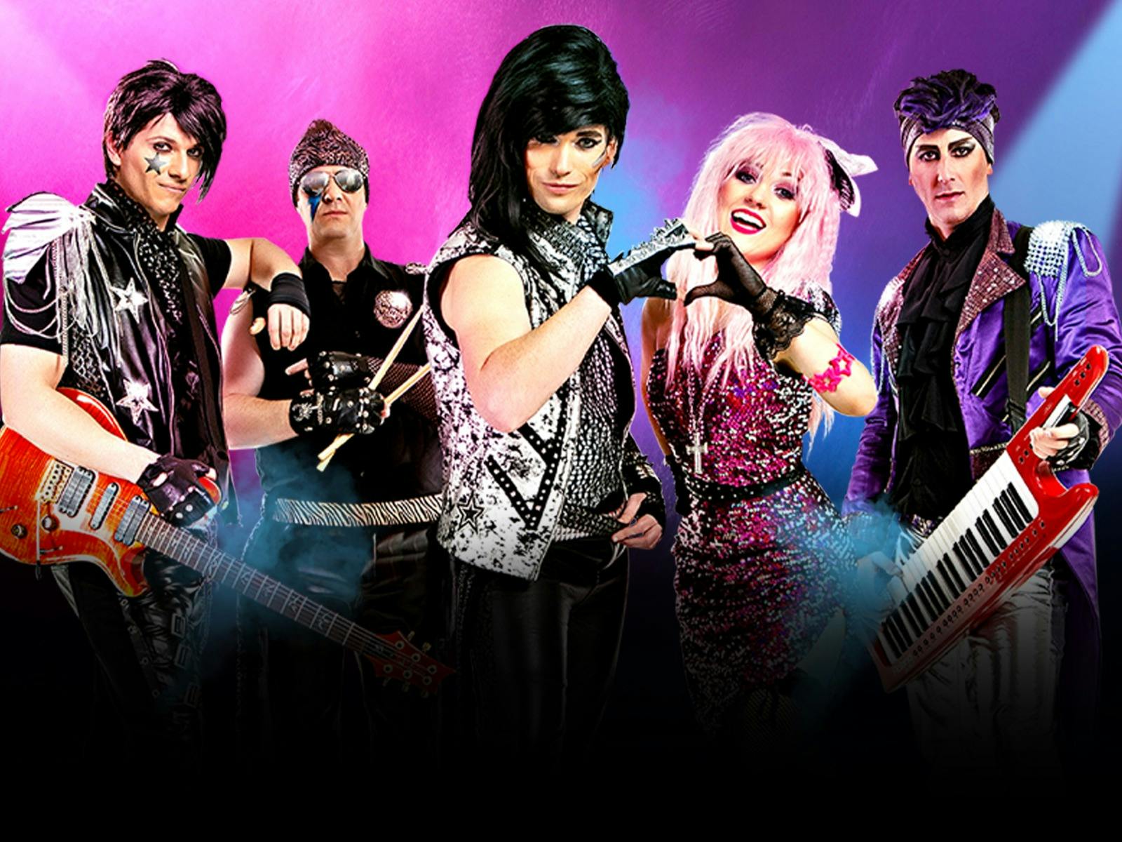 Five bandmembers posing in front of a colourful backdrop