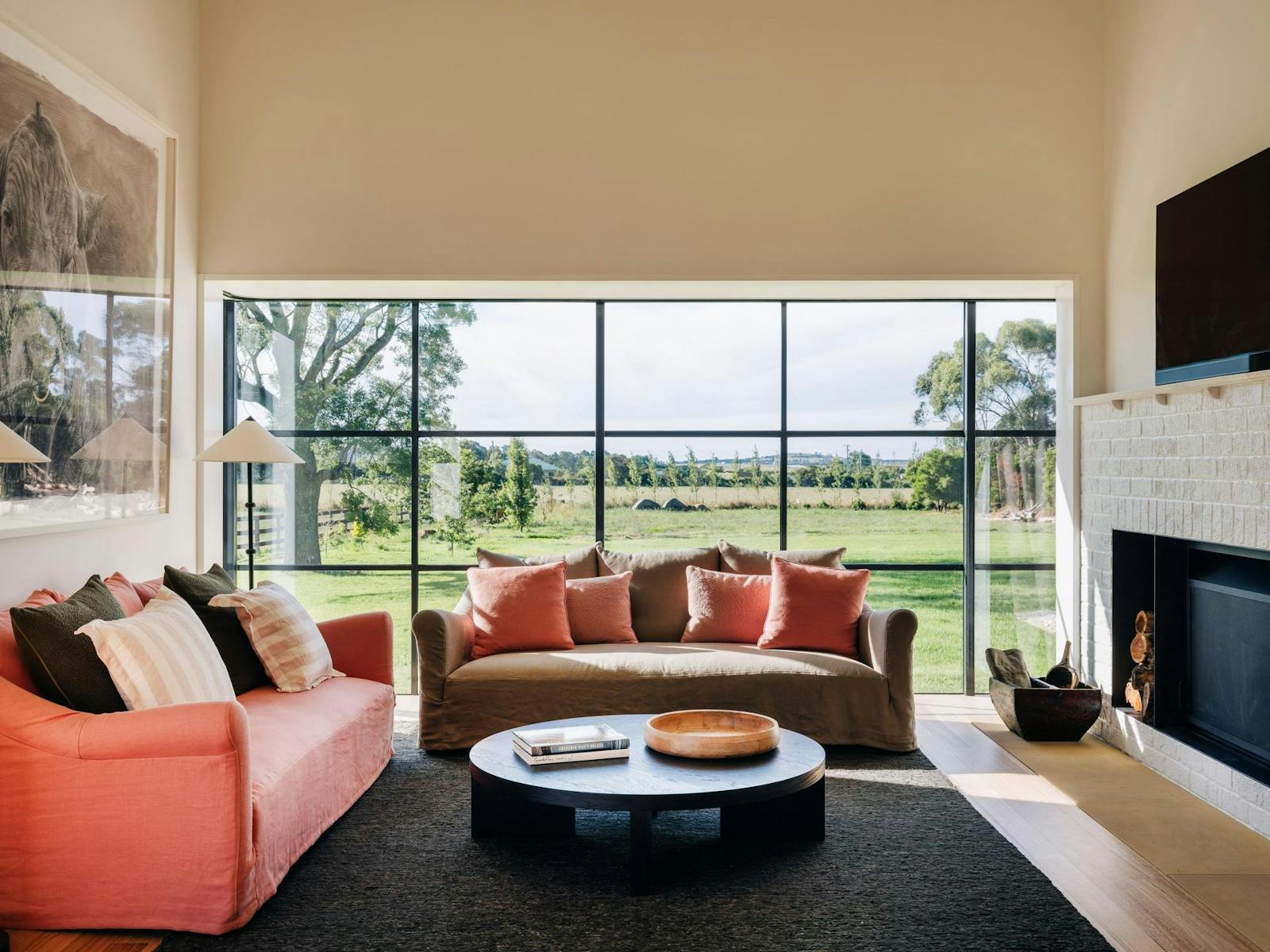 Beautiful sitting room with Coco Republic furniture, oversized Jet Master fire, and farm vistas.