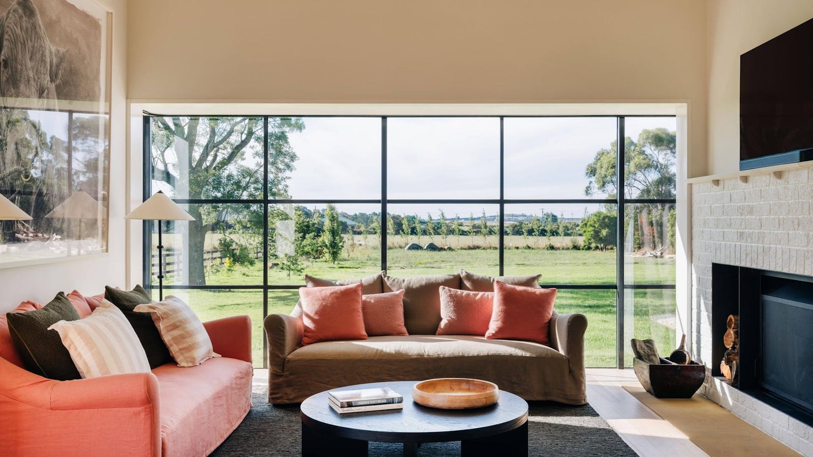 Beautiful sitting room with Coco Republic furniture, oversized Jet Master fire, and farm vistas.